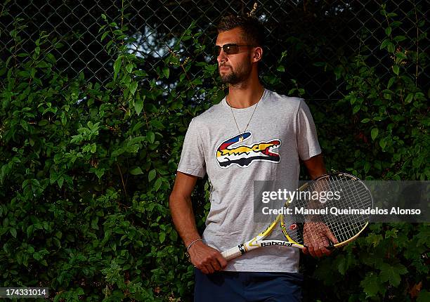 Professional tennis player Benoit Paire poses during a Maui Jim shoot at Lagardere Racing Club on July 23, 2013 in Paris, France.