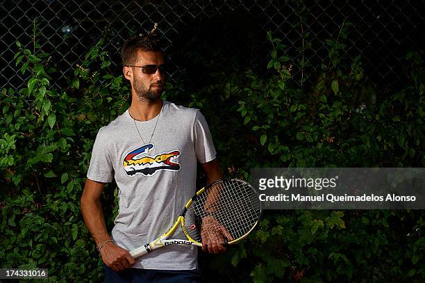 Professional tennis player Benoit Paire poses during a Maui Jim shoot at Lagardere Racing Club on July 23, 2013 in Paris, France.