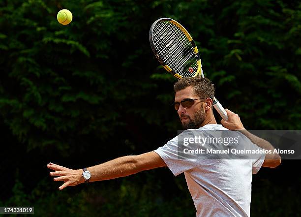 Professional tennis player Benoit Paire poses during a Maui Jim shoot at Lagardere Racing Club on July 23, 2013 in Paris, France.