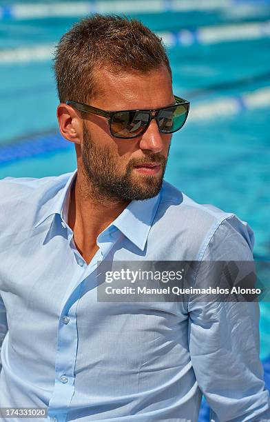 Professional tennis player Benoit Paire poses during a Maui Jim shoot at Lagardere Racing Club on July 23, 2013 in Paris, France.