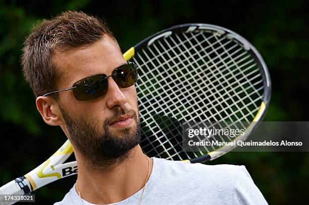 Professional tennis player Benoit Paire poses during a Maui Jim shoot at Lagardere Racing Club on July 23, 2013 in Paris, France.