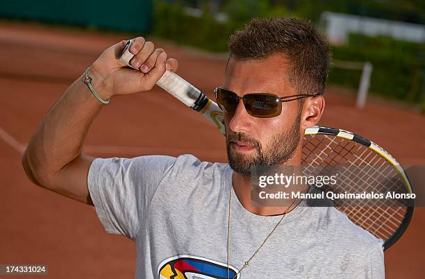 Professional tennis player Benoit Paire poses during a Maui Jim shoot at Lagardere Racing Club on July 23, 2013 in Paris, France.