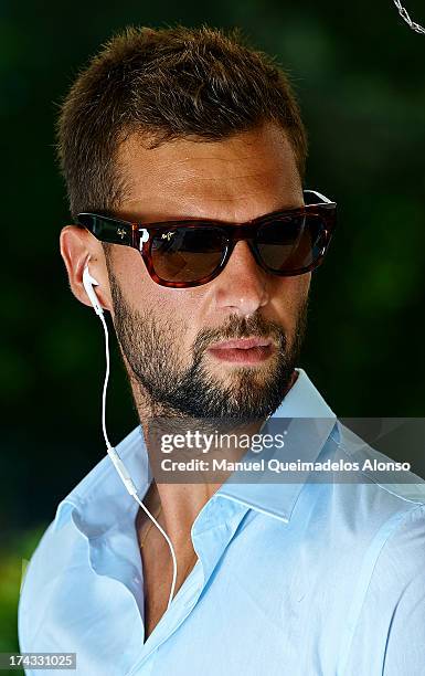 Professional tennis player Benoit Paire poses during a Maui Jim shoot at Lagardere Racing Club on July 23, 2013 in Paris, France.