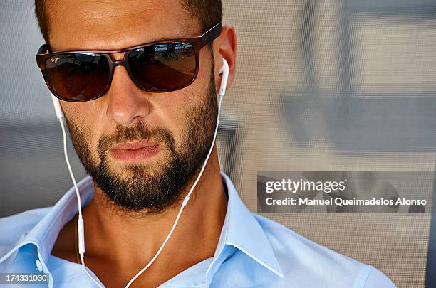 Professional tennis player Benoit Paire poses during a Maui Jim shoot at Lagardere Racing Club on July 23, 2013 in Paris, France.