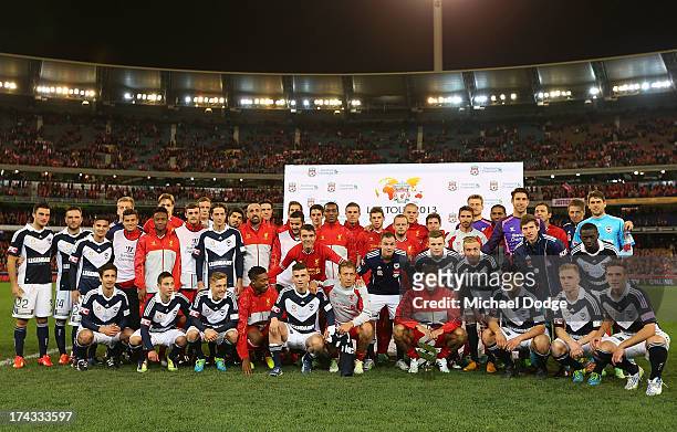 The Victory and Liverpool team pose together during the match between the Melbourne Victory and Liverpool at Melbourne Cricket Ground on July 24,...