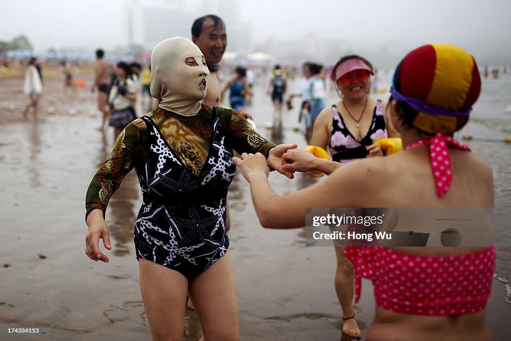 Odd Face-masked Swimmers In China