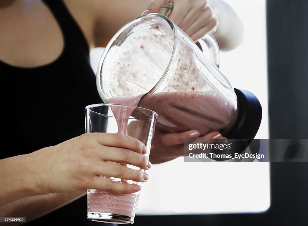 Close-Up of Woman Pouring a Meal Replacement Shakes