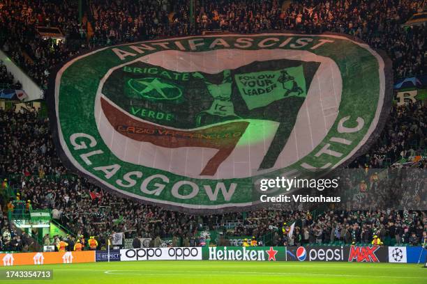 Celtic fans hold up an anti-fascist banner before the UEFA Champions League match between Glasgow Celtic FC and SS Lazio at Celtic Park Stadium on...