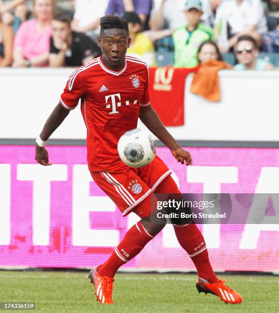 David Alaba of FC Bayern Muenchen runs with the ball during the Telekom 2013 Cup final between FC Bayern Muenchen and Borussia Moenchengladbach at...