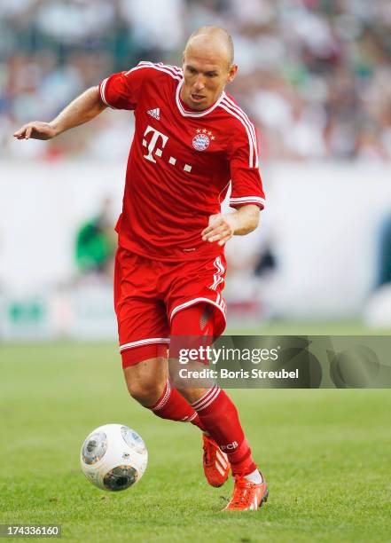 Arjen Robben of FC Bayern Muenchen runs with the ball during the Telekom 2013 Cup final between FC Bayern Muenchen and Borussia Moenchengladbach at...