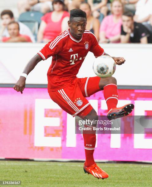 David Alaba of FC Bayern Muenchen runs with the ball during the Telekom 2013 Cup final between FC Bayern Muenchen and Borussia Moenchengladbach at...