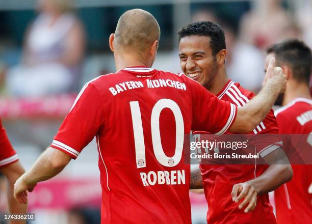 Thiago and Arjen Robben of FC Bayern Muenchen celebrate during the Telekom 2013 Cup final between FC Bayern Muenchen and Borussia Moenchengladbach at...