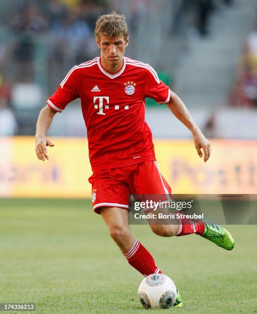 Thomas Mueller of FC Bayern Muenchen runs with the ball during the Telekom 2013 Cup final between FC Bayern Muenchen and Borussia Moenchengladbach at...