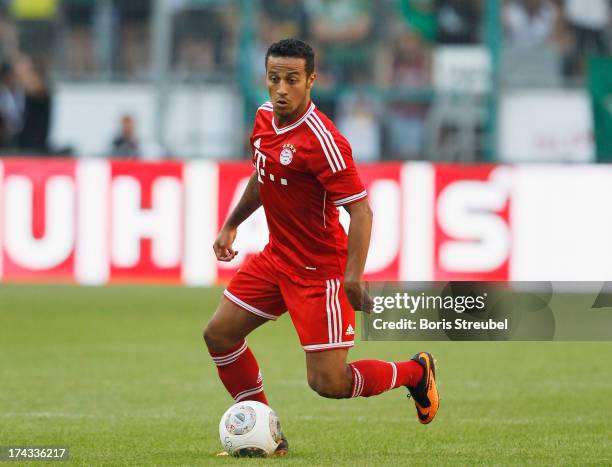 Thiago of FC Bayern Muenchen runs with the ball during the Telekom 2013 Cup final between FC Bayern Muenchen and Borussia Moenchengladbach at...