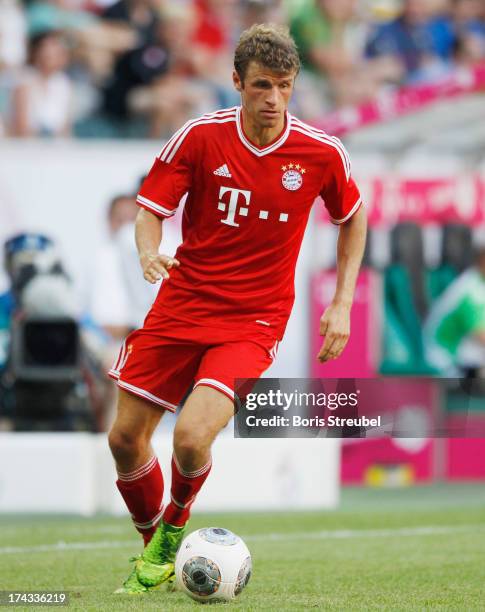 Thomas Mueller of FC Bayern Muenchen runs with the ball during the Telekom 2013 Cup final between FC Bayern Muenchen and Borussia Moenchengladbach at...