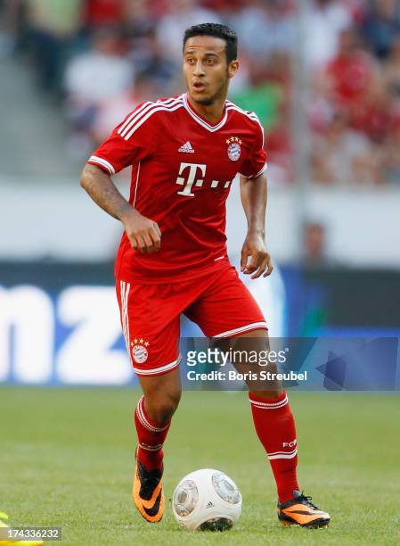 Thiago of FC Bayern Muenchen runs with the ball during the Telekom 2013 Cup final between FC Bayern Muenchen and Borussia Moenchengladbach at...