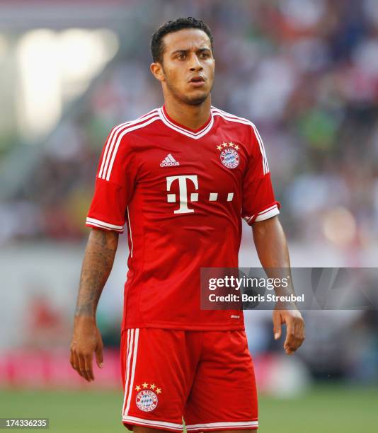 Thiago of FC Bayern Muenchen looks on during the Telekom 2013 Cup final between FC Bayern Muenchen and Borussia Moenchengladbach at Borussia-Park on...