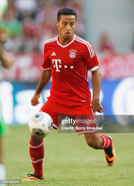 Thiago of FC Bayern Muenchen runs with the ball during the Telekom 2013 Cup final between FC Bayern Muenchen and Borussia Moenchengladbach at...