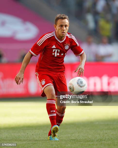 Rafinha of FC Bayern Muenchen runs with the ball during the Telekom 2013 Cup final between FC Bayern Muenchen and Borussia Moenchengladbach at...