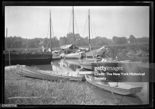 Huntington, Long Island: unidentified small dinghy's and sailboats moored in an inlet, New York, New York, late 19th or early 20th century.