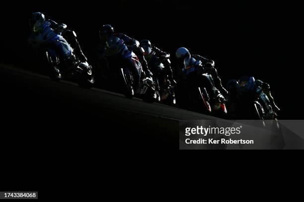 Rory Parker of RP Racing and Joe Moore of Clearline Racing lead a group of riders during the Pirelli National Superstock race at Brands Hatch on...