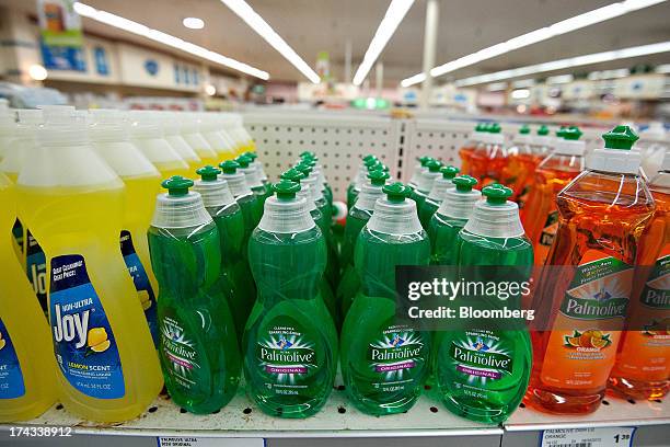 Bottles of Colgate-Palmolive Co. Palmolive brand dishwashing liquid, center and right, are displayed for sale on a supermarket shelf in Princeton,...