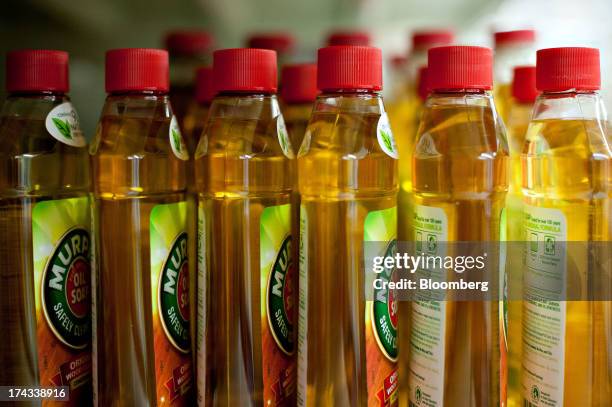 Bottles of Colgate-Palmolive Co. Murphy Oil Soap brand wood cleaner are displayed for sale on a supermarket shelf in Princeton, Illinois, U.S., on...