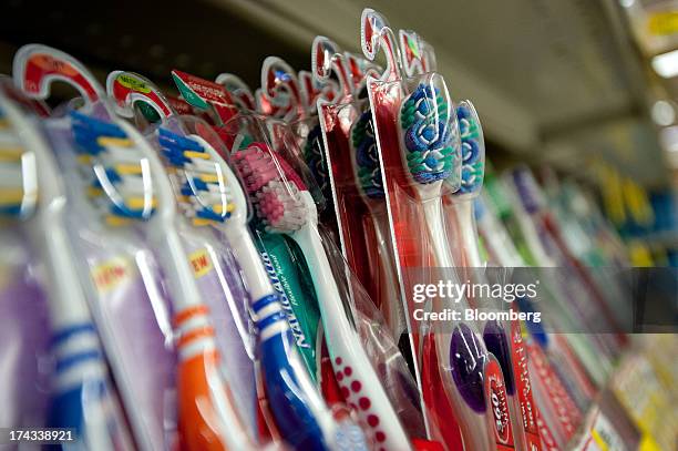 Colgate-Palmolive Co. Colgate brand toothbrushes are displayed for sale on a supermarket shelf in Princeton, Illinois, U.S., on Tuesday, July 23,...