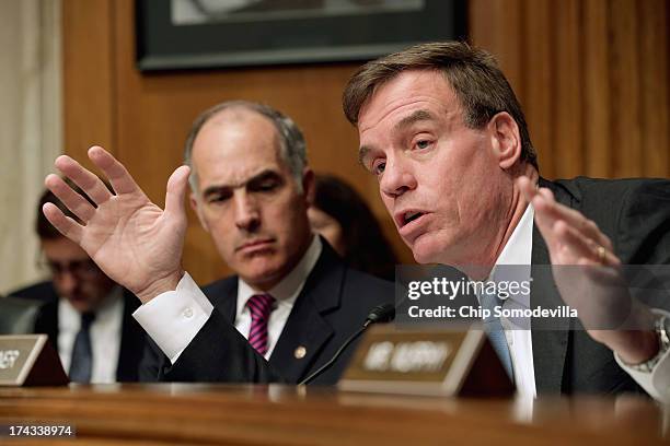 Joint Economic Committee member Sen. Mark Warner delivers an opening statement during a hearing about on fixing America's crumbling infrastructure...