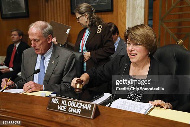 Joint Economic Committee Vice Chair Sen. Amy Klobuchar gavels into session a hearing about on fixing America's crumbling infrastructure with Sen. Dan...