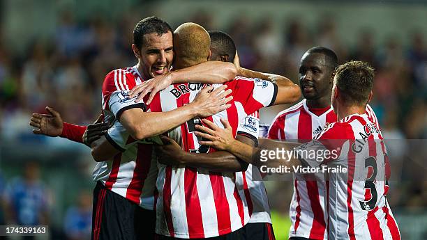 Wes Brown of Sunderland is congratulated byu team-mates after scoring a goal during the Barclays Asia Trophy Semi Final match between Tottenham...