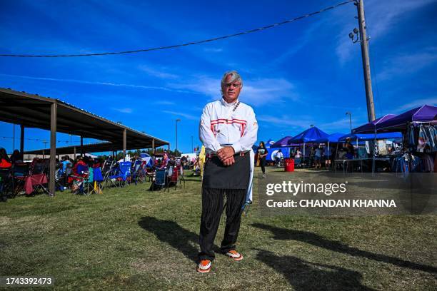 Man poses for a phote as he attends a cultural meeting at the Comanche Nation fairgrounds in Lawton, Oklahoma on September 30, 2023. After Alaska,...