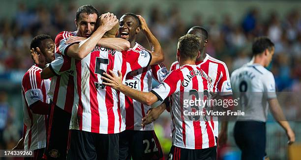 Wes Brown of Sunderland celebrates with team-mates after scoring a goal during the Barclays Asia Trophy Semi Final match between Tottenham Hotspur...