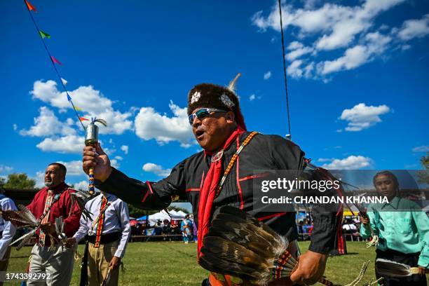Indigenous peoples of the Americas dance and perform rituals as they attend a cultural meeting at the Comanche Nation fairgrounds in Lawton, Oklahoma...