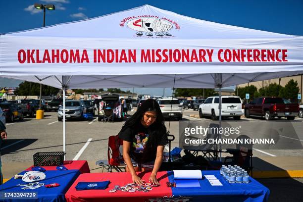 Codie Horse-Topetchy, student at the university of Oklahoma and oordinator of Rock the Native Vote, arranges her stall during a cultural meeting at...