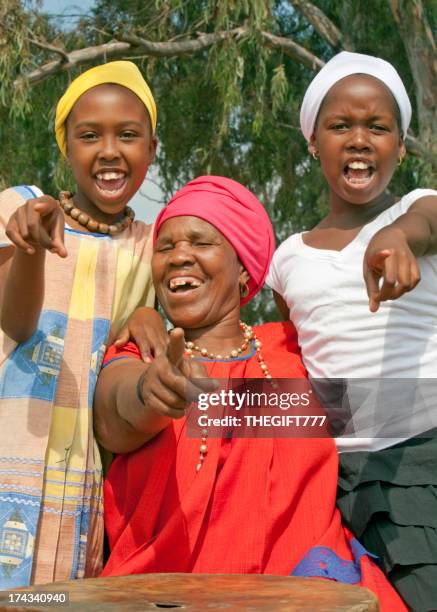 three cheering people - african music stock pictures, royalty-free photos & images