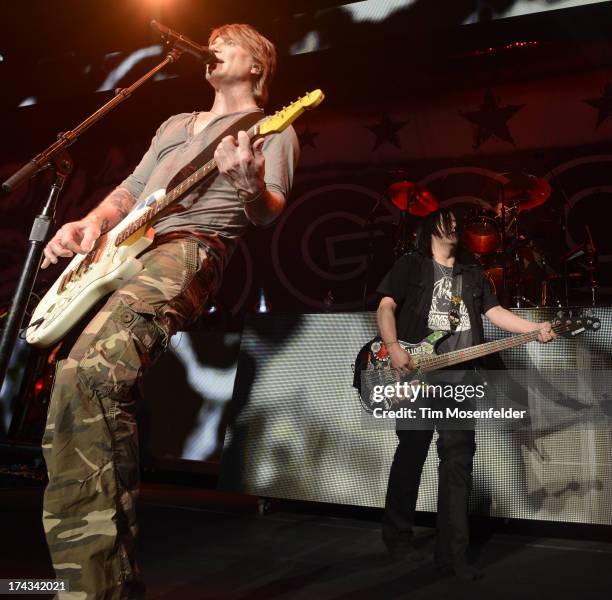 John Rzeznik and Robby Takac of Goo Goo Dolls perform in support of the bands' Magnetic release at Sleep Train Pavilion on July 23, 2013 in Concord,...