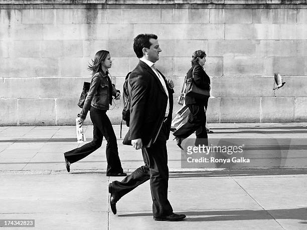 Workers in suits, executives, black and white candid street photography, London UK, rush hour