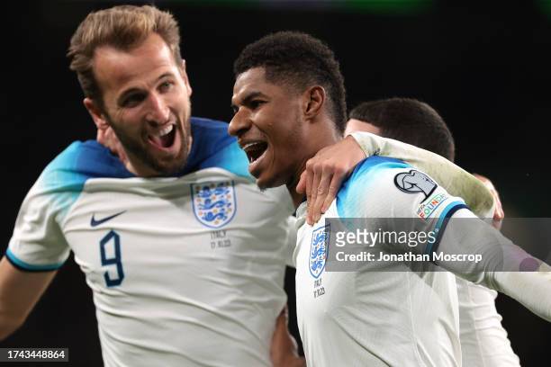 Marcus Rashford of England celebrates with team mate Harry Kane after scoring to give the side a 2-1 lead during the UEFA EURO 2024 European...