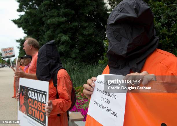 July 24 : Protesters outside of the Hart Senate Office Building in Washington, D.C. Protest the hearing to examine closing Guantanamo, focusing on...