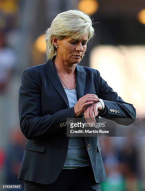 Silvia Neid, head coach of Germany looks at her watch during the UEFA Women's Euro 2013 semi final match between Sweden and Germany at Gamla Ullevi...