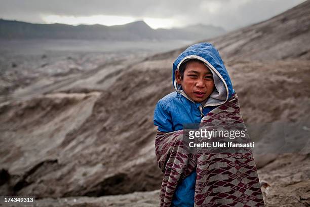 Doni, stands at foot of Mount Bromo during the Yadnya Kasada Festival at crater of Mount Bromo on July 24, 2013 in Probolinggo, East Java, Indonesia....