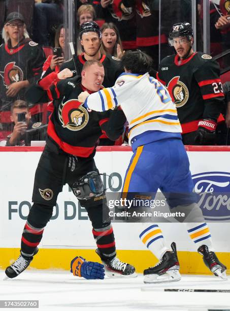 Brady Tkachuk of the Ottawa Senators fights against Alex Tuch of the Buffalo Sabres at Canadian Tire Centre on October 24, 2023 in Ottawa, Ontario,...