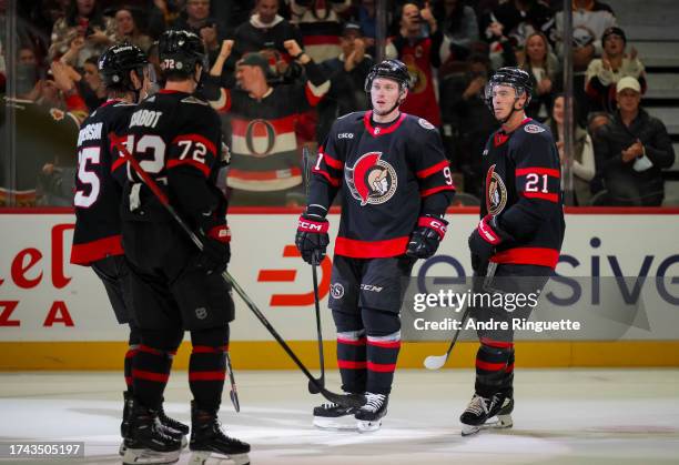 Vladimir Tarasenko of the Ottawa Senators celebrates his third period goal against the Buffalo Sabres with teammates Mathieu Joseph, Thomas Chabot,...