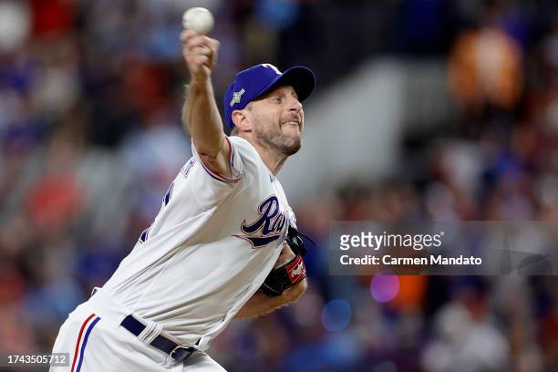 Max Scherzer of the Texas Rangers throws a pitch against the Houston Astros during the first inning in Game Three of the American League Championship...