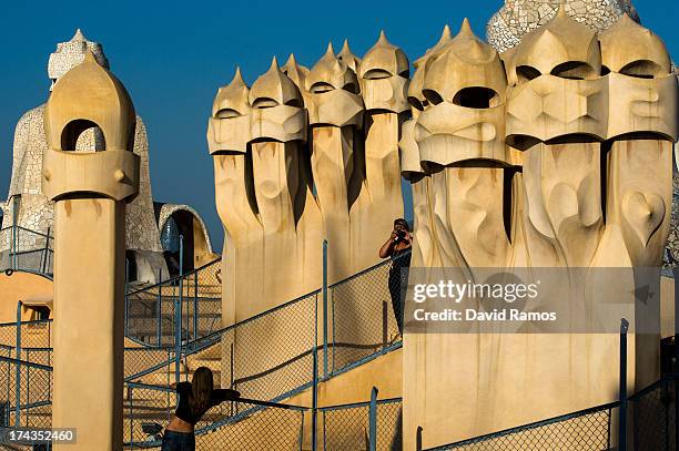 People visit the roof of Antoni Gaudi's building 'La Pedrera' or 'Casa Mila' on July 24, 2013 in Barcelona, Spain. Foreign visitors to Spain set a...