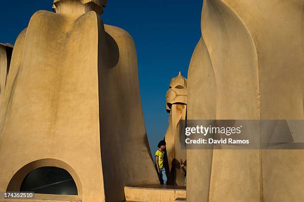 Woman visits the roof of Antoni Gaudi's building 'La Pedrera' or 'Casa Mila' on July 24, 2013 in Barcelona, Spain. Foreign visitors to Spain set a...