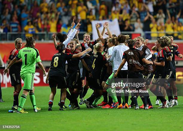 The team of Germany celebrate after the UEFA Women's Euro 2013 semi final match between Sweden and Germany at Gamla Ullevi on July 24, 2013 in...