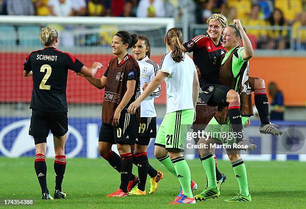 Almuth Schult of Germany celebrate with team mate Saskia Bartusiak after the UEFA Women's Euro 2013 semi final match between Sweden and Germany at...