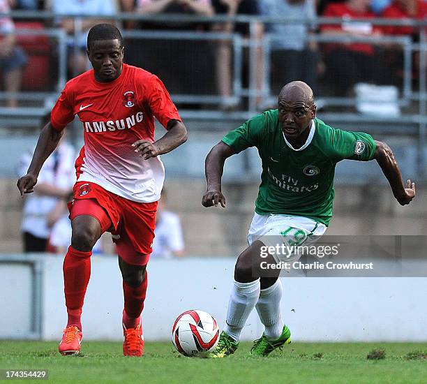 Marcos Senna of New York Cosmos looks to get away from Orient's Kevin Lisbie during the pre season friendly match between Leyton Orient and New York...